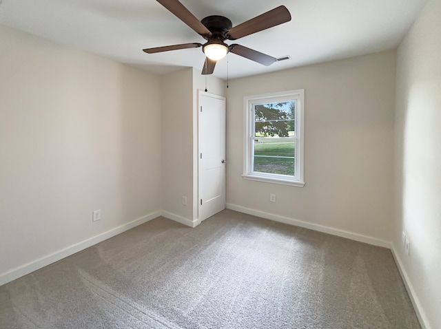 carpeted empty room with ceiling fan