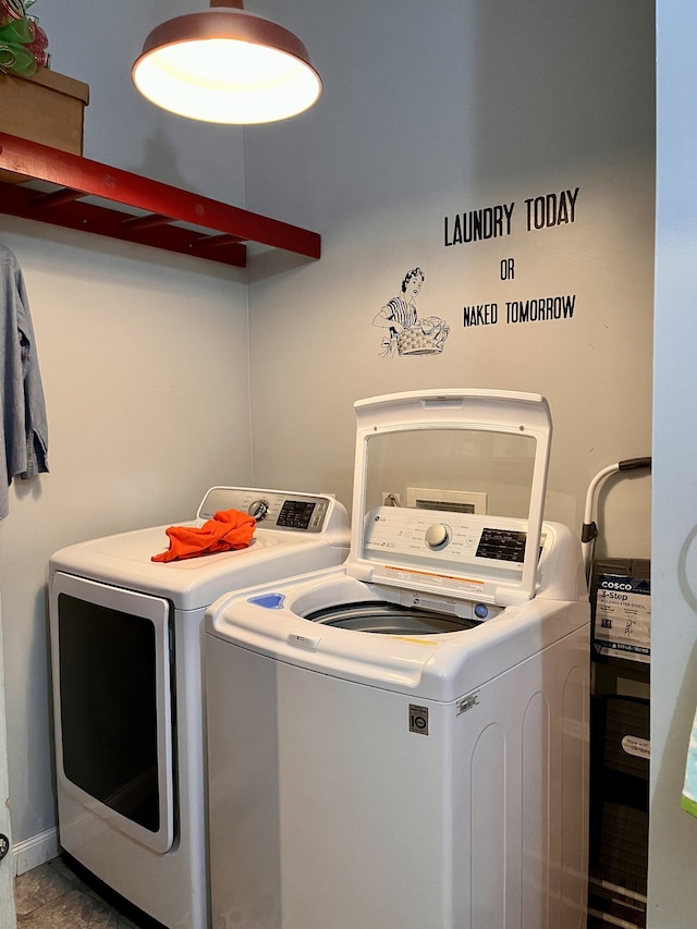 laundry room with separate washer and dryer