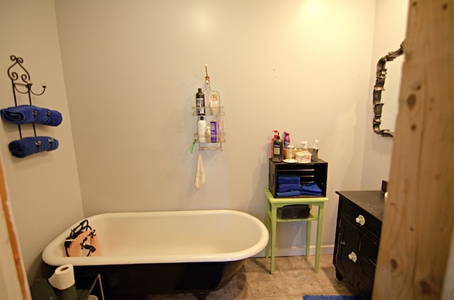 bathroom featuring a bath and vanity