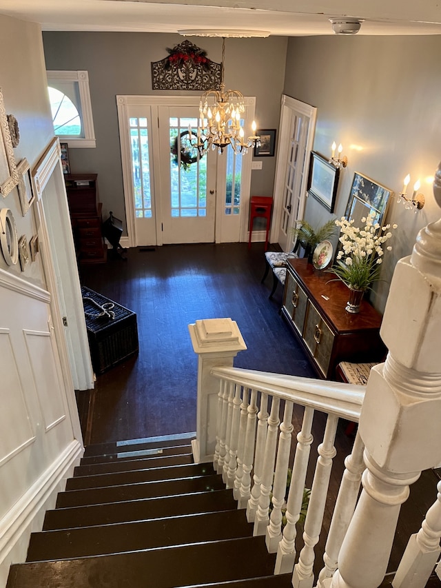 staircase with hardwood / wood-style floors