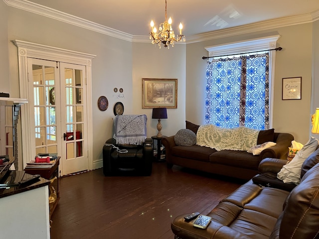 living room featuring ornamental molding, dark hardwood / wood-style flooring, and a notable chandelier