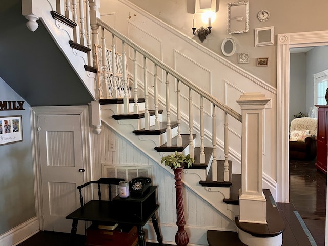 staircase with wood-type flooring