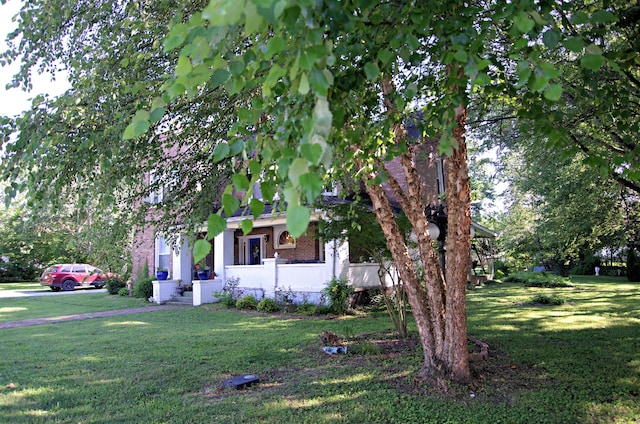 view of property exterior with a lawn