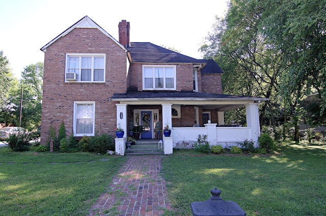 view of front of home with cooling unit, a porch, and a front lawn