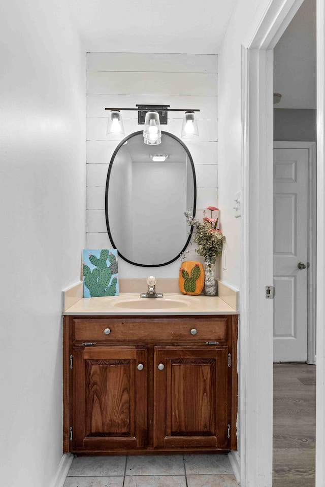 bathroom with vanity and hardwood / wood-style flooring