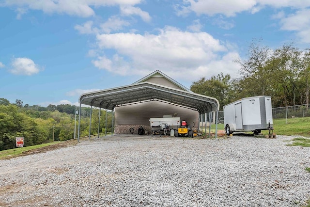 view of vehicle parking with a carport