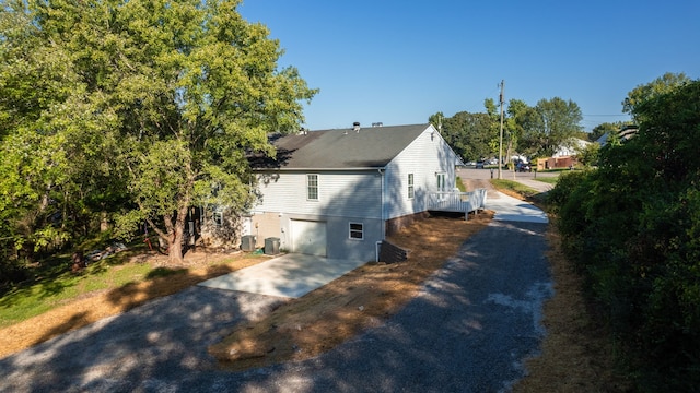 view of home's exterior with central AC