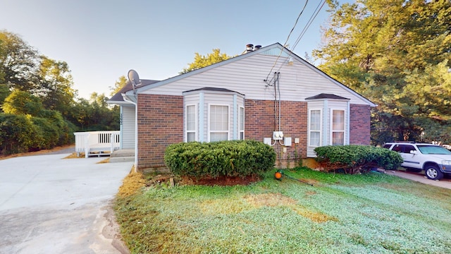 view of home's exterior with a yard