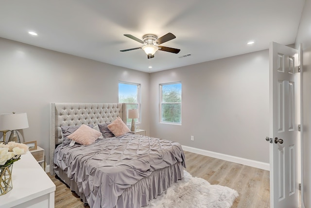 bedroom featuring ceiling fan and light hardwood / wood-style flooring