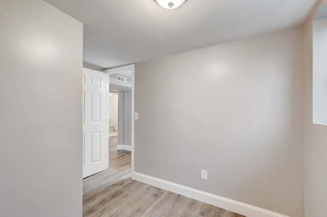 spare room with light hardwood / wood-style floors