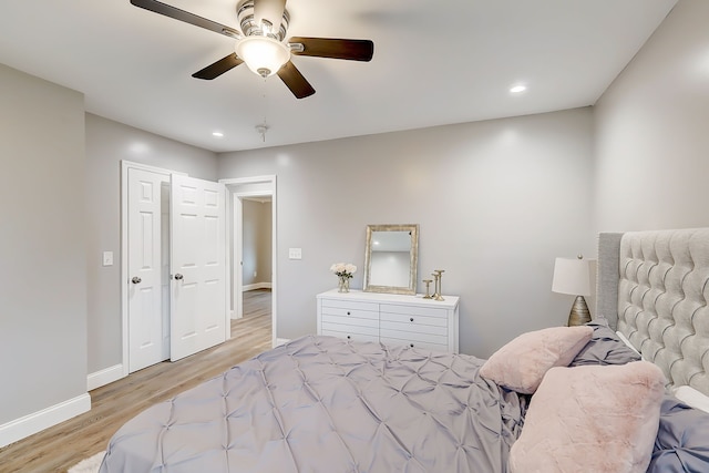 bedroom featuring ceiling fan and light hardwood / wood-style floors