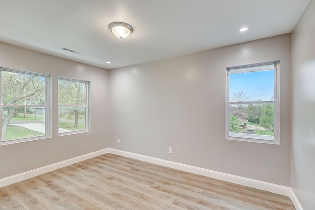 spare room featuring light wood-type flooring