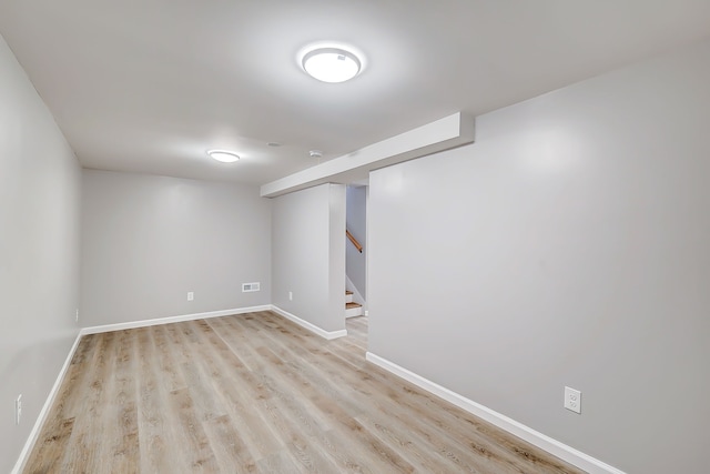 basement featuring light hardwood / wood-style flooring