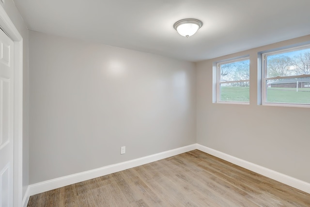 unfurnished room with light hardwood / wood-style flooring