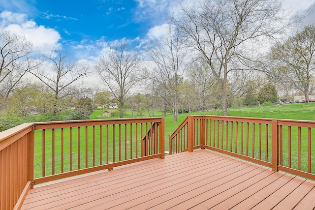 wooden terrace with a lawn