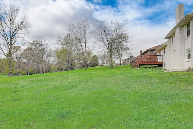 view of yard with a wooden deck