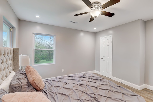 bedroom featuring light hardwood / wood-style floors and ceiling fan