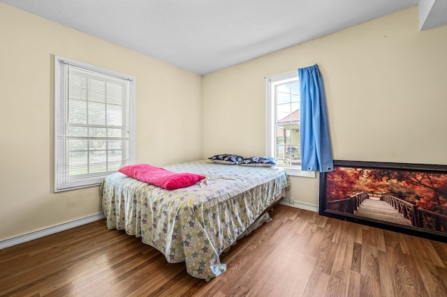 bedroom featuring wood-type flooring