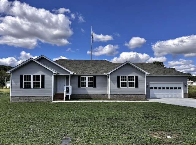 single story home with a garage and a front lawn