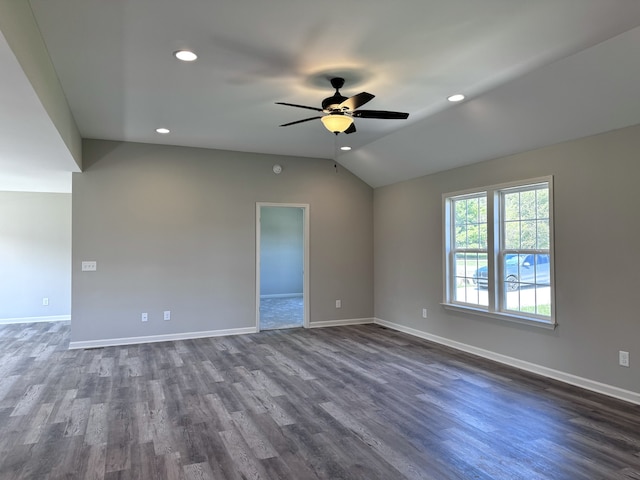 spare room featuring ceiling fan, lofted ceiling, and dark hardwood / wood-style flooring