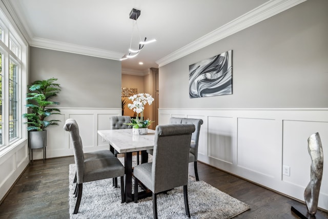 dining room featuring crown molding and dark hardwood / wood-style flooring