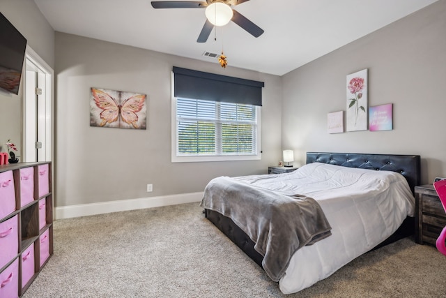 bedroom featuring ceiling fan and carpet