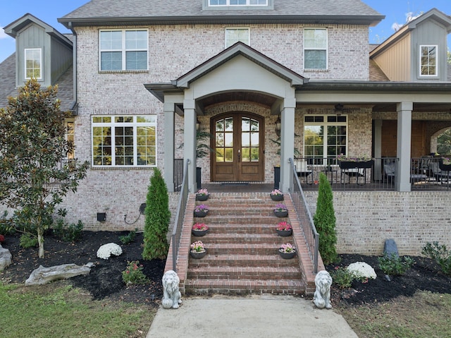 property entrance with french doors and a porch