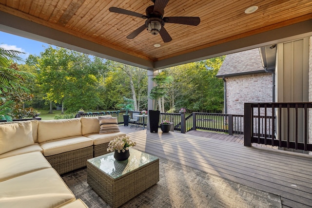 wooden terrace featuring an outdoor hangout area and ceiling fan