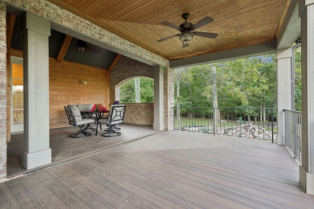 wooden deck featuring ceiling fan