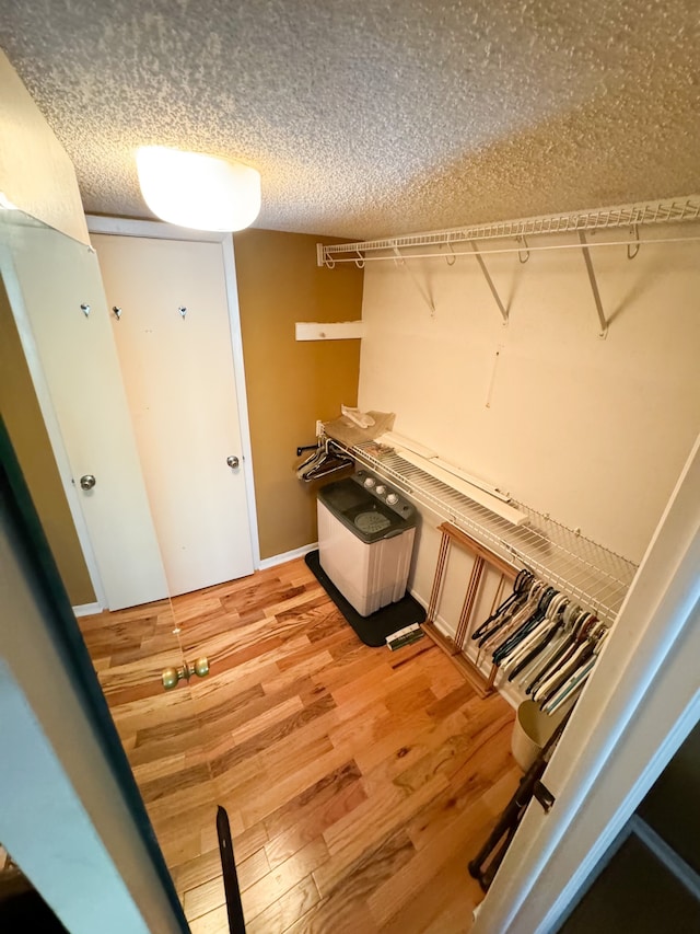 spacious closet featuring light hardwood / wood-style flooring