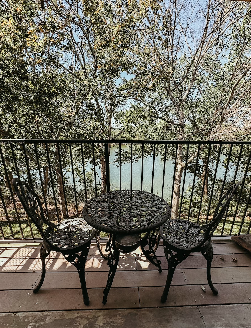 balcony featuring a water view