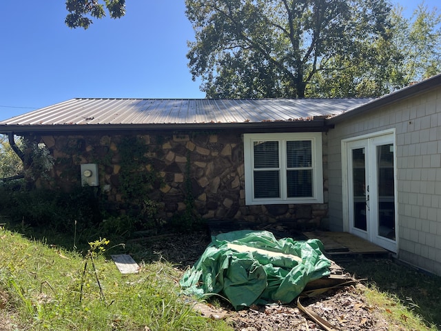 view of side of property featuring french doors