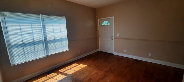 empty room with wood-type flooring