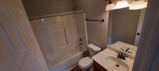 full bathroom featuring vanity, toilet, and  shower combination