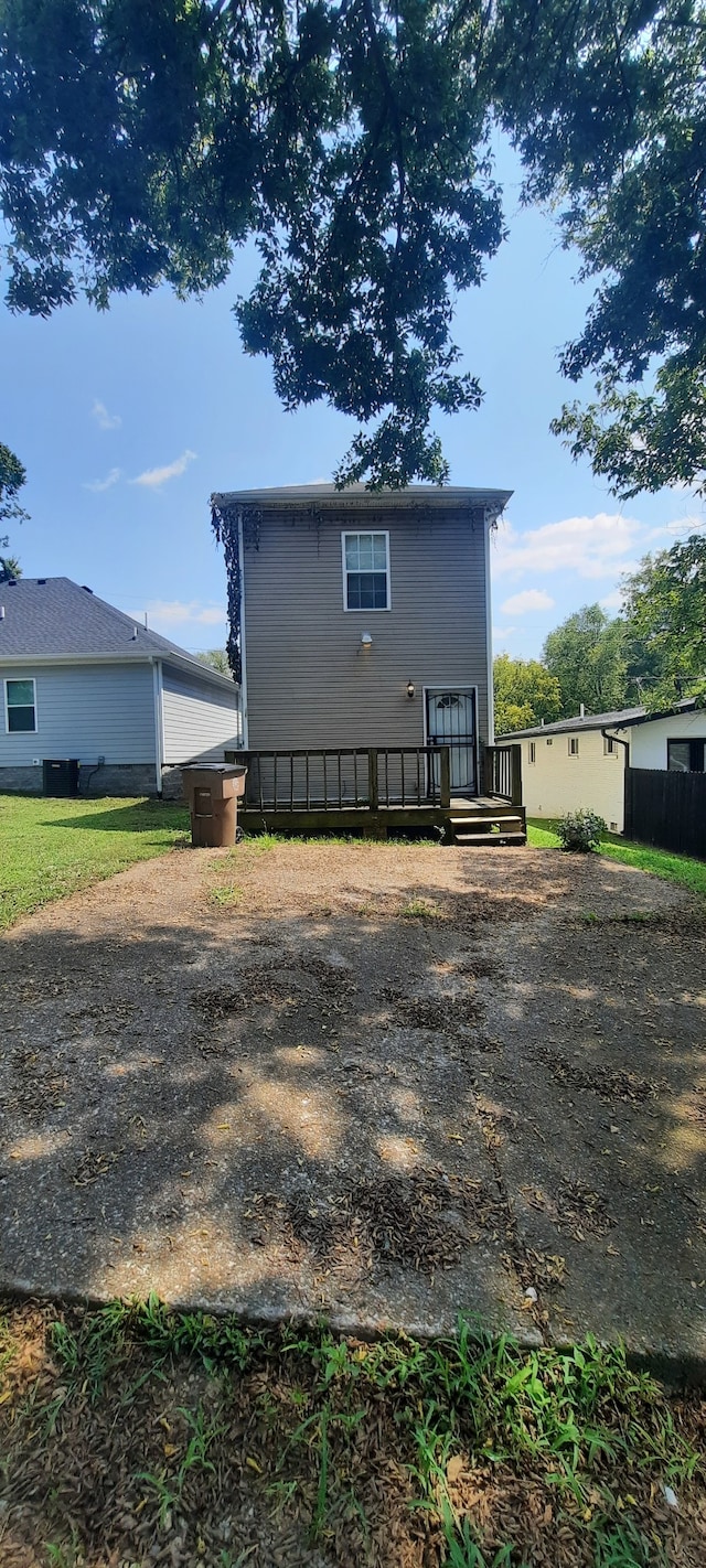 back of house featuring a deck