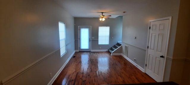 doorway to outside with ceiling fan and dark hardwood / wood-style flooring