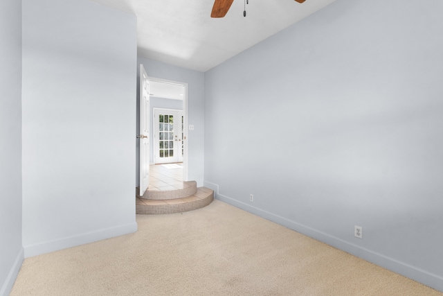 carpeted empty room with ceiling fan