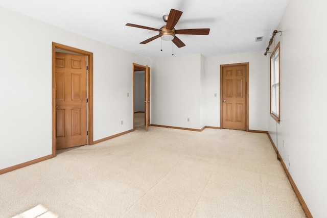 carpeted empty room with ceiling fan