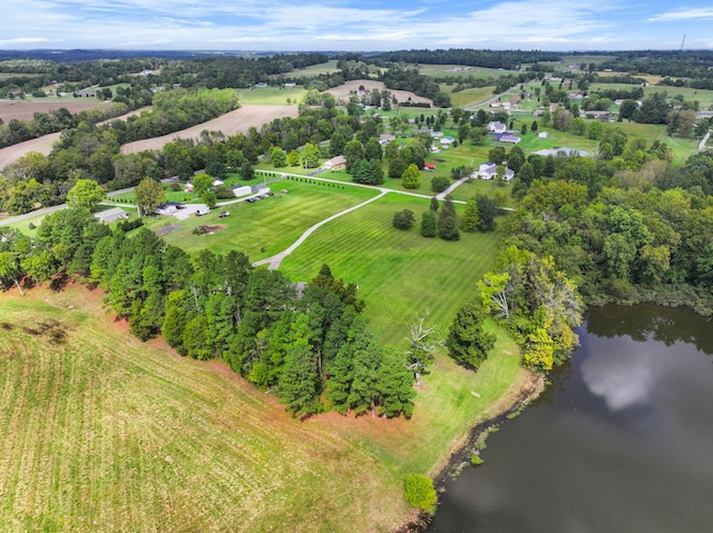 drone / aerial view featuring a water view and a rural view