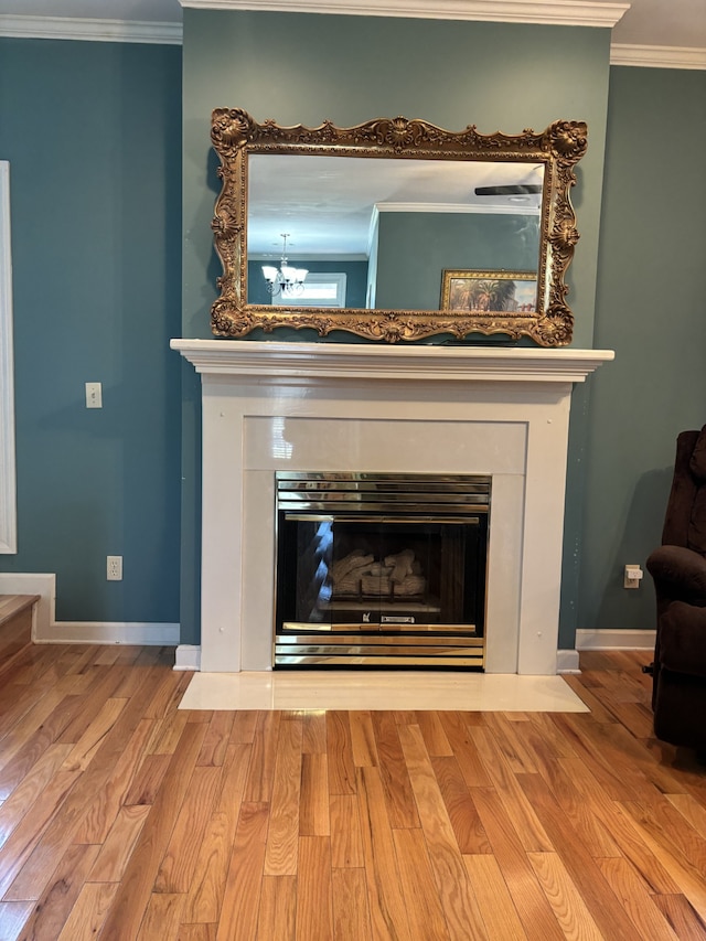 details featuring hardwood / wood-style flooring and crown molding