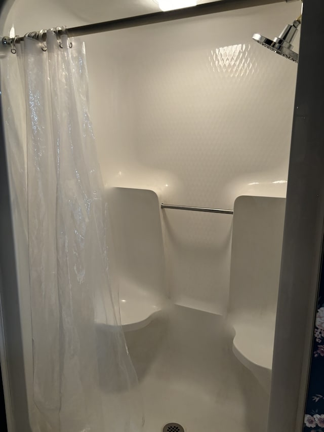 bathroom with curtained shower