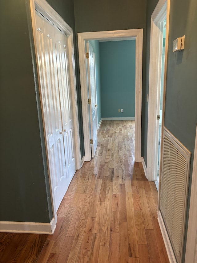 hall with light hardwood / wood-style floors