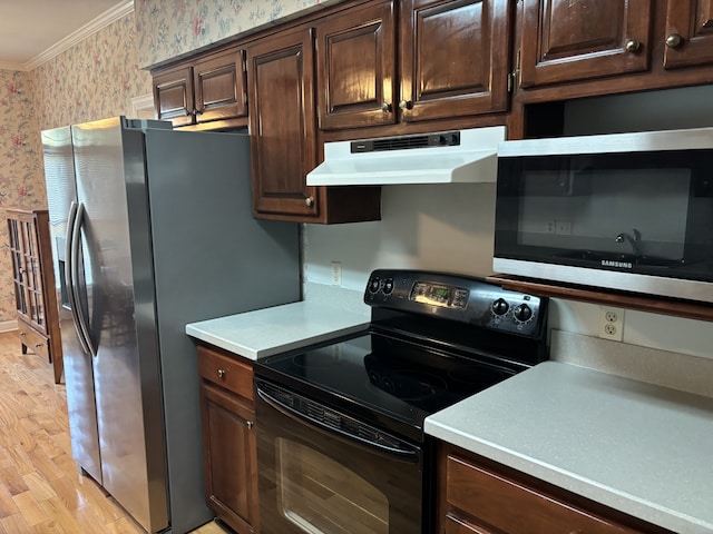 kitchen featuring dark brown cabinets, stainless steel appliances, crown molding, and light hardwood / wood-style floors