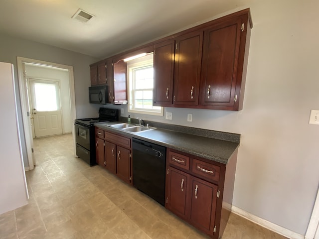 kitchen with sink and black appliances