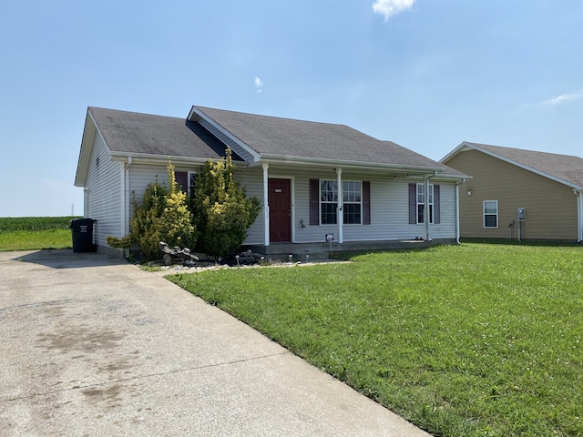 ranch-style home with a front lawn