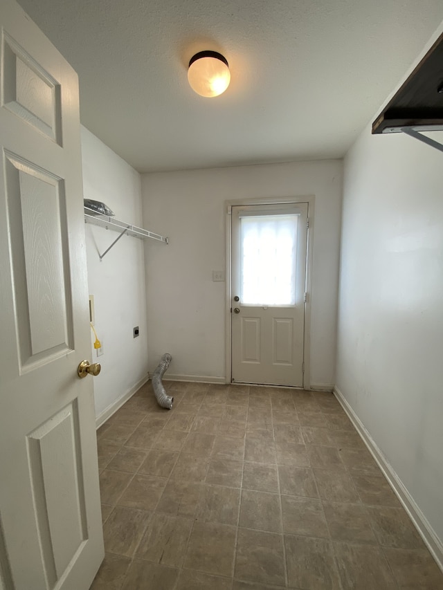 washroom with hookup for an electric dryer