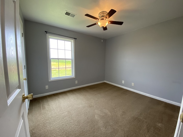 carpeted empty room with ceiling fan