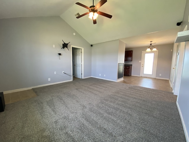 unfurnished living room featuring dark carpet, ceiling fan, and high vaulted ceiling