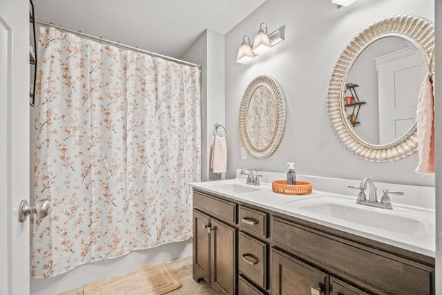 bathroom featuring a shower with curtain and vanity