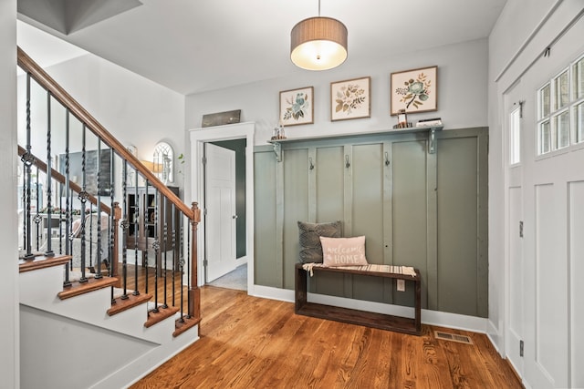 mudroom featuring a wealth of natural light and hardwood / wood-style flooring